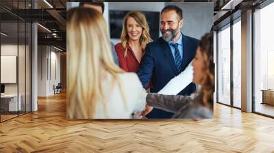 Happy Business Team Celebrating Success with Group Handshake Wall mural