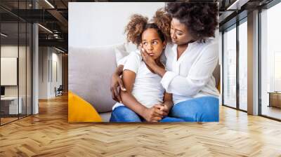 Loving worried mom psychologist consoling counseling talking to upset little child girl showing care give love support, single parent mother comforting sad small sullen kid daughter feeling offended Wall mural