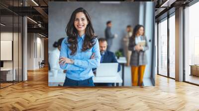 Shot of a confident young businesswoman standing in a modern office. Portrait of a businesswoman standing in the office. One Happy Pretty Business Woman Standing in office Wall mural