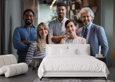 Shot of a group of well-dressed businesspeople standing together. Successful business team smiling teamwork corporate office colleague. Positive multi racial corporate team posing looking at camera Wall mural