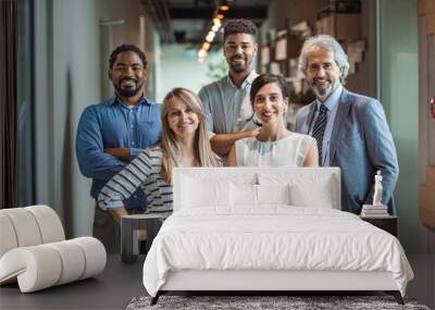 Shot of a group of well-dressed businesspeople standing together. Successful business team smiling teamwork corporate office colleague. Ready to make success happen Wall mural