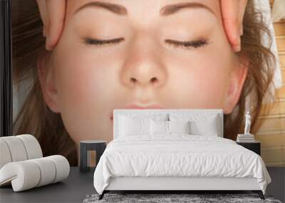 woman receiving facial massage Wall mural