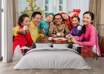 Family at the Tet table Wall mural