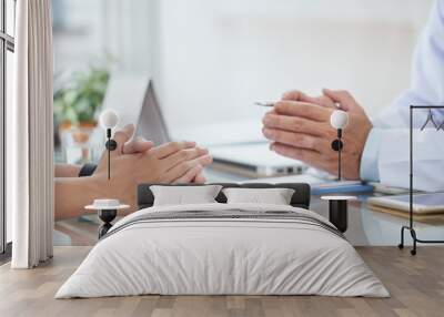 Hands of doctor and patient during conversation Wall mural