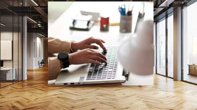 Woman working online on laptop Wall mural