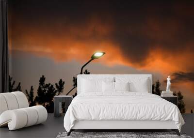 Public street lighting pole with LED lights with an amazing sunset color background. Wall mural