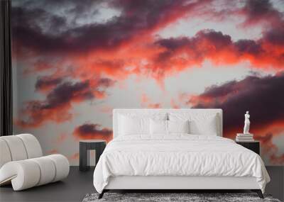 Vivid orange sunset against blue sky. Beautiful landscape of the amazing autumn sunsets. Color of nature. Great for background and mindfulness concept photo. Wall mural