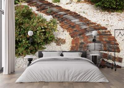 Decorative wooden path on the lawn. Wall mural