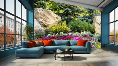 lanscape design. beautiful garden of blue spruce, bright yellow chrysanthemum and other vegetation, paths with pebbles for a walk Wall mural