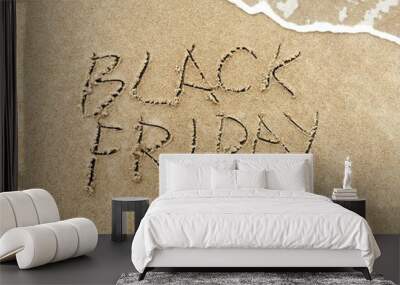 Black Friday poster. Embossing on wet sand. Summer beach background.  Wall mural