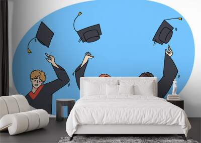 Excited students in mantles throw caps in air overjoyed with college or university graduation. Smiling graduates celebrate school finish. Education and success. Vector illustration. Wall mural