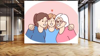 Family portrait of three female generations with teenage girl lovingly hugging mother and grandmother. Happy women of different generations spend time together enjoying family vacation Wall mural