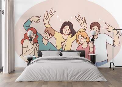 Smiling people have fun posing together Wall mural