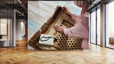 Above view of Middle Eastern woman prepares for a prayer at home. Wall mural