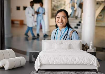 Happy Asian nursing student at medical university looking at camera. Wall mural