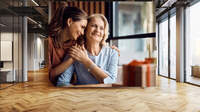 Happy senior woman enjoys in daughter's affection on Mother's day. Wall mural