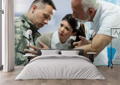 Worried military soldier with wife at counseling in the hospital. Wall mural