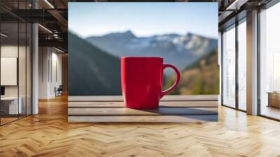 Close up of a red Mug on a wooden Table in the Mountains. Blurred natural Background Wall mural