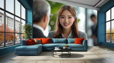 Asian businesswoman handshaking with mature businessman at corporate office, Generative AI Wall mural