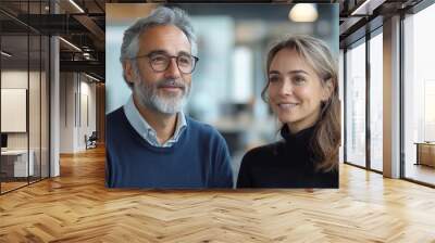 Mature Latin business man and European business woman discussing project in modern office. Two diverse partners, colleagues, team of confident professional business people work together, Generative AI Wall mural