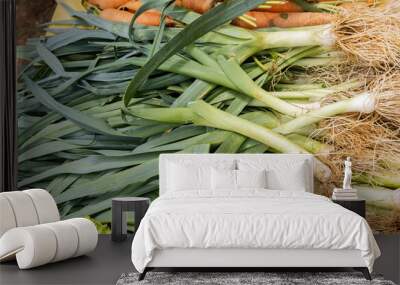 fresh vegetables on stall, bunch of leeks  Wall mural