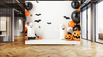 Festive Halloween decoration featuring playful ghosts, pumpkins, and vibrant balloons in black and orange colors. Wall mural