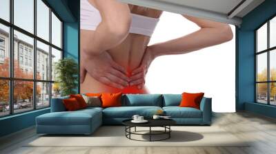 Back Pain. Woman rubbing muscles of her lower back isolated on white background. Sports exercising injury. Wall mural