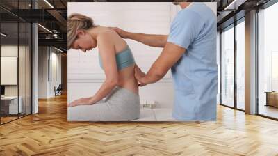 Chiropractic treatment, Back pain relief. Physiotherapy / Kinesiology for female patient. Scoliosis, Posture Correction. Wall mural