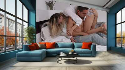 Happy couple having fun in bedroom. Love, Foreplay, Passion, Relationship concept Wall mural