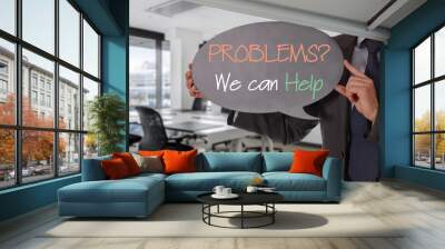 Problems we can help. Businessman holding blackboard. Business vision, success, team work, leadership concept Wall mural