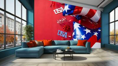 4th of July, USA Presidents Day, Independence Day concept. Flat lay composition with foil balloons in American flag colors and USA signs on red background. Wall mural