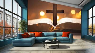 A wooden cross symbol, an open book with pages illuminated by warm bokeh lights, religious faith concept, soft ethereal glow, spiritual atmosphere Wall mural