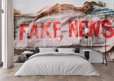 Crumpled newspaper, bold red letters, text FAKE NEWS, distressed paper, realistic details, high contrast, white background, close-up shot, media criticism, political commentary Wall mural