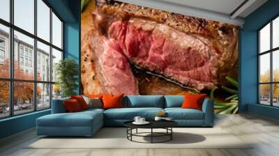 Medium Rare Ribeye steak on wooden board Wall mural