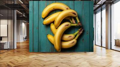 Ripe bananas, distressed turquoise wood background, rustic texture, chipped paint, vibrant yellow fruit, organic spotting, food photography, high contrast, macro detail, weathered surface, natural lig Wall mural