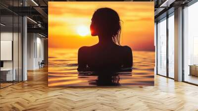 silhouette of a woman in water at sunset, ocean waves, warm colors, dramatic lighting, peaceful atmosphere, self-reflection concept, nature and serenity Wall mural