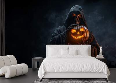 Grim reaper holding halloween pumpkin on black background with smoke. Carved Jack-o'-lantern. Death in black clothes. Scary haunting monster. Banner with copy space Wall mural