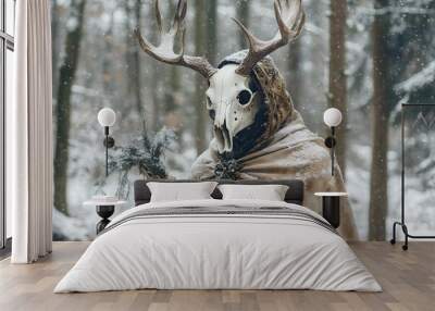 Shaman in deer animal skull in cloak in snowy forest. Mystical occult ritual. Pagan Christmas, Winter solstice, New Year celebration. Scandinavian culture. Yule tradition. Wall mural