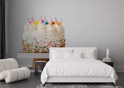 A beautifully decorated birthday cake with sprinkles and icing, displayed on a plain white background for a minimalist yet festive vibe Wall mural