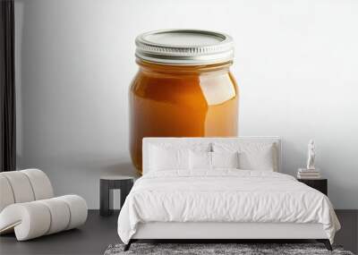 A petite glass jar of peach jam, with a tightly sealed metal lid, standing against a white background, perfect for gourmet food packaging and preserves. Wall mural