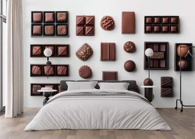 A selection of beautifully designed chocolate shapes in elegant packaging, isolated on a clean white background for a luxurious presentation Wall mural