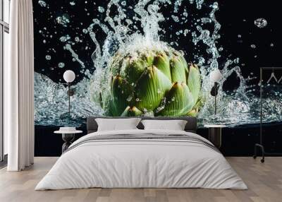 A whole artichoke creating a splash when dropped into water with bright studio lights Wall mural