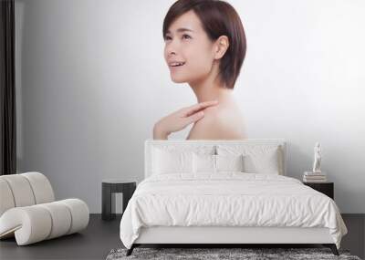 Young beautiful Asian female model on the white background Wall mural