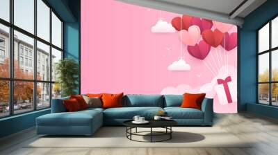 Vector concept of a banner for valentine's day with a gift box that fly on balloons from hearts. Paper pink background on which paper clouds hang. Wallpaper, flyers, invitations, posters, brochures. Wall mural