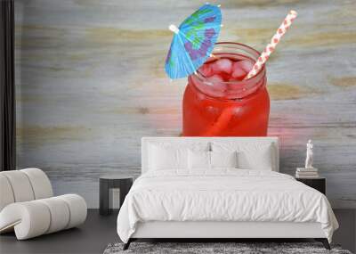 fruit drink in mason jar with paper umbrella and straw Wall mural