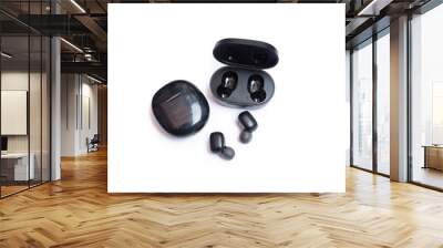 Wireless earphone airbuds, black color on isolated white background Wall mural