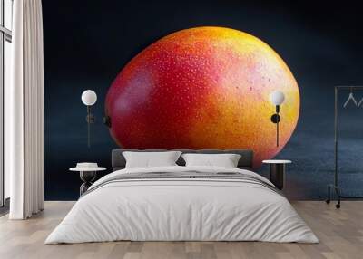 a mango with clear visibility of its shape and color variations including any slight blemishes or texture details isolated on a dark background Wall mural