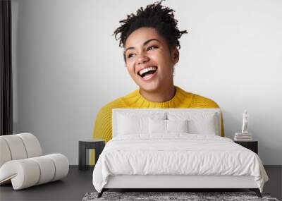 Beautiful young african happy excited emotional woman posing isolated over white wall background. Wall mural