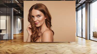 beauty portrait of mystery smiling ginger woman with long hair Wall mural