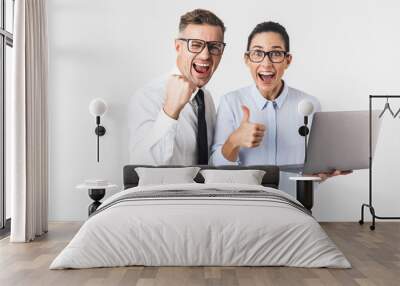 Business colleagues couple isolated over white wall background using laptop computer. Wall mural